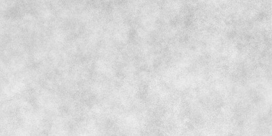 Light grey granular mist softly textures a pale paper surface